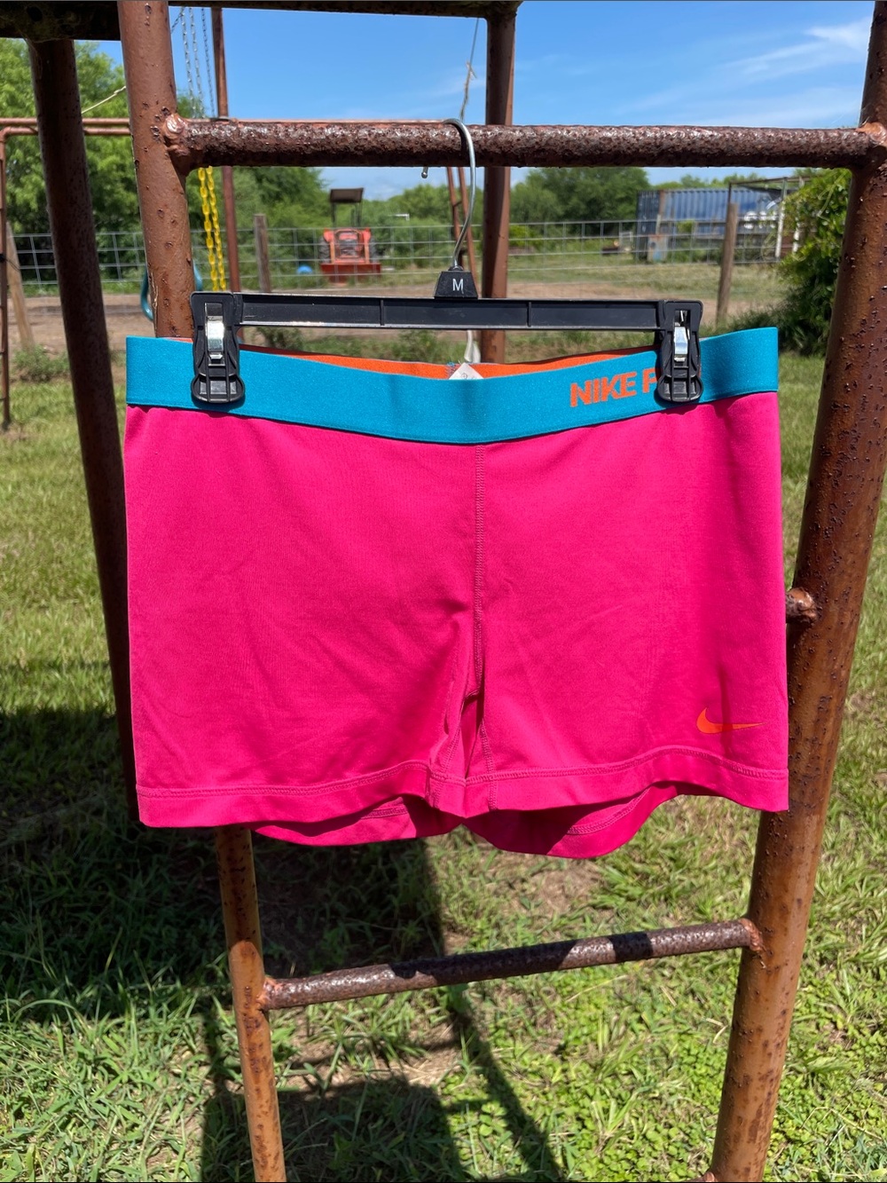 Nike Pro Women's Hot Pink Athletic Shorts with Teal Waistband
